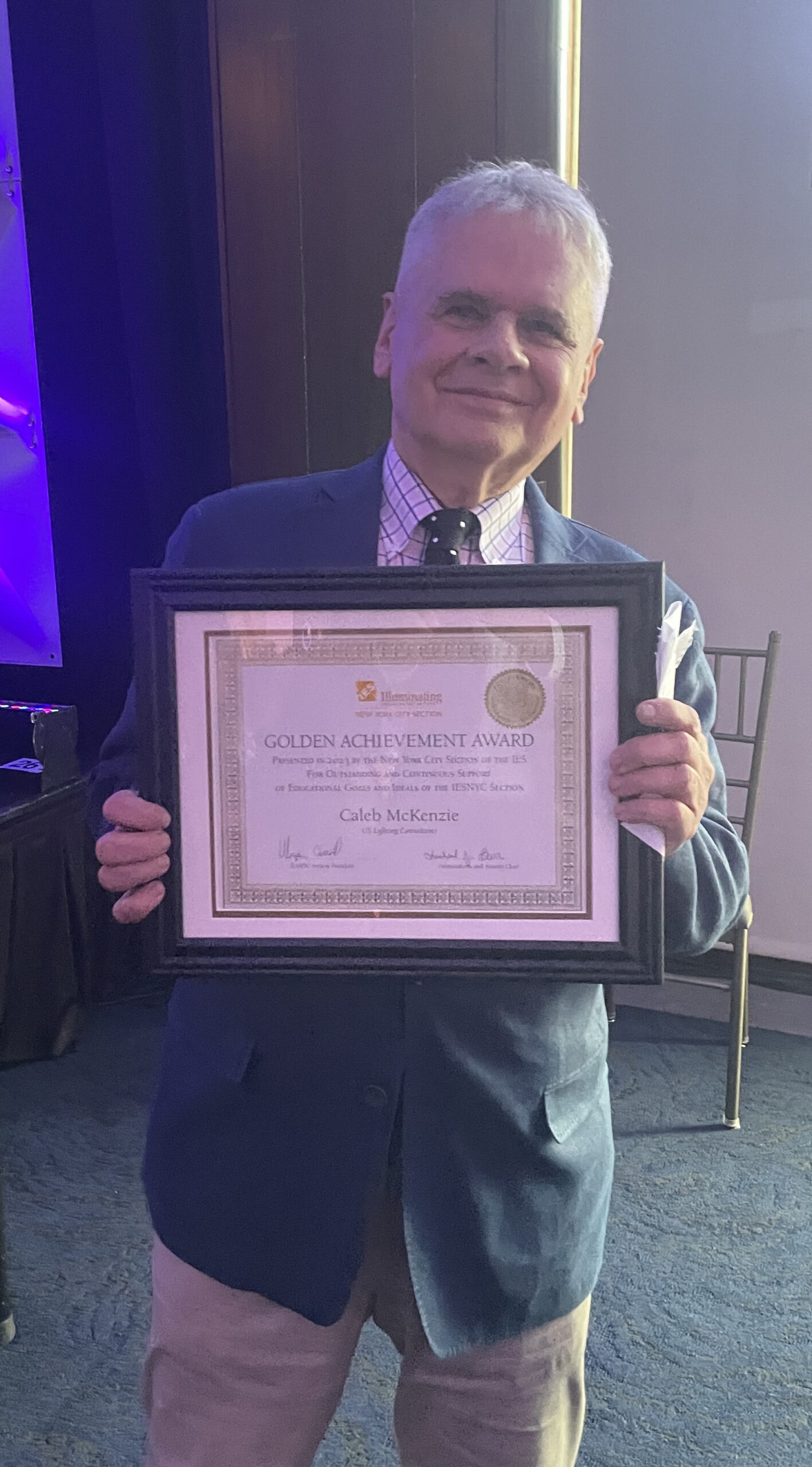 Caleb McKenzie receives an IESNYC Service Award