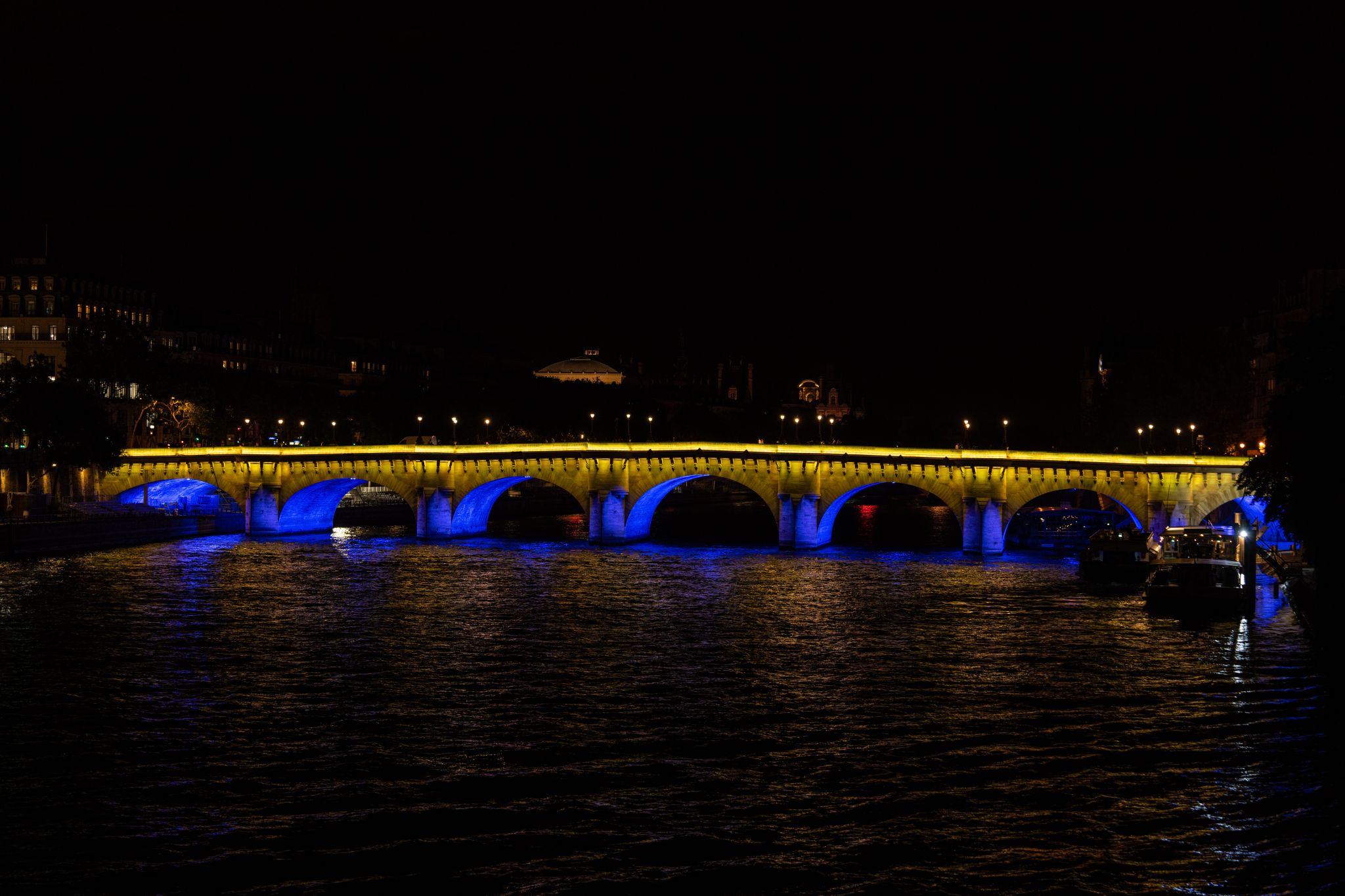 GVA Lighting Illuminates Pont Neuf Bridge with shades of blue and yellow