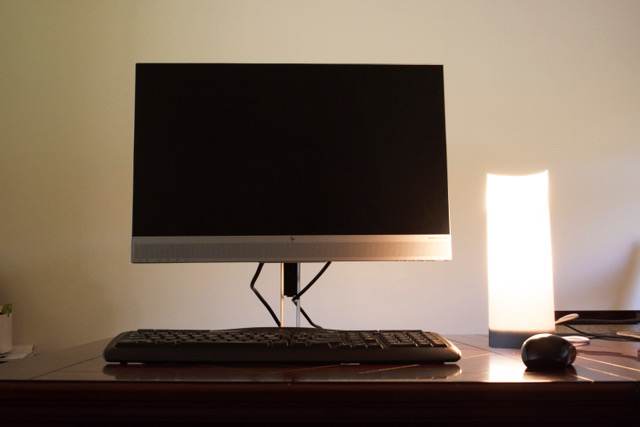 Image of computer with warm white light next to it